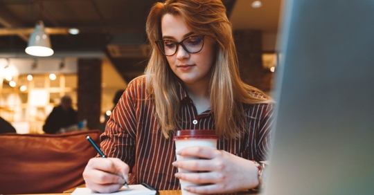 student taking notes